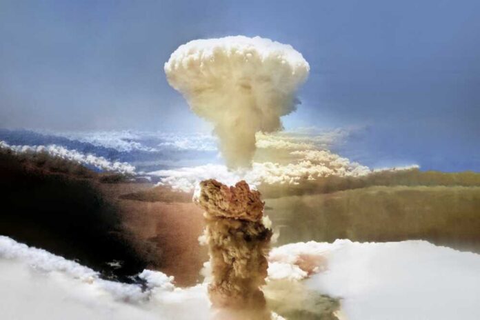 A large mushroom cloud rising into the sky from a nuclear explosion
