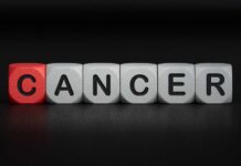 Blocks spelling the word 'CANCER' with one block in red