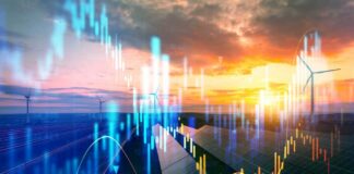 A landscape featuring solar panels and wind turbines with data graphs overlaying the sunset