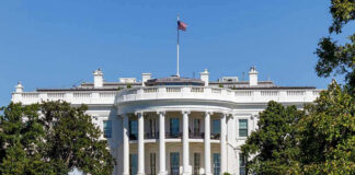White House with trees and fountain.