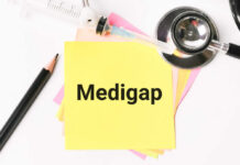 A yellow sticky note with the word 'Medigap' surrounded by medical tools and colored paper
