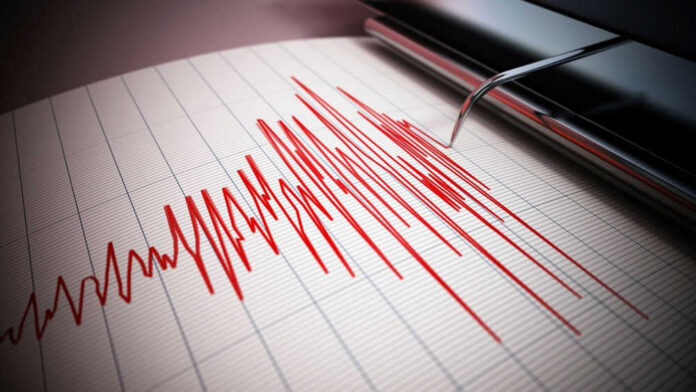 Seismograph recording earthquake activity in red.