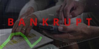 Hands using a smartphone with a financial chart and the word 'BANKRUPT' overlayed