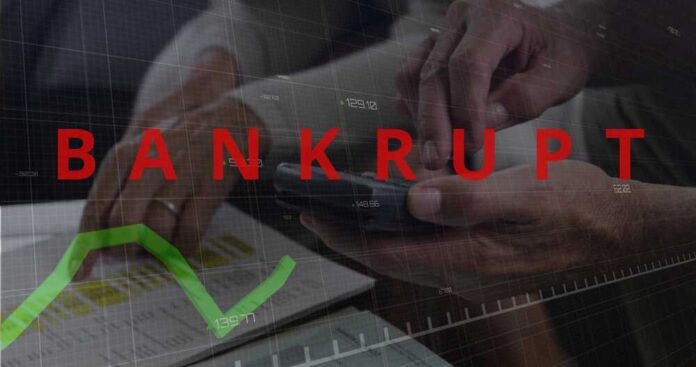 Hands using a smartphone with a financial chart and the word 'BANKRUPT' overlayed