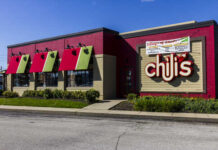 Exterior view of a Chili's restaurant with colorful awnings