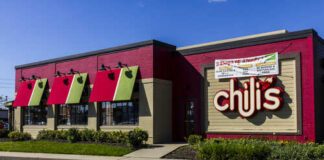 Exterior view of a Chili's restaurant with colorful awnings