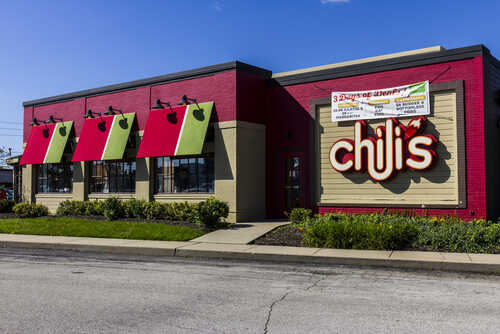 Exterior view of a Chili's restaurant with colorful awnings
