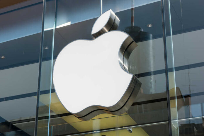 Apple logo displayed prominently on a glass storefront