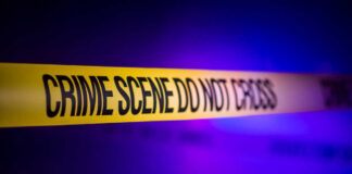 Fatal Dive Mystery: Who Knew the Risk? Yellow crime scene tape with the words 'CRIME SCENE DO NOT CROSS'