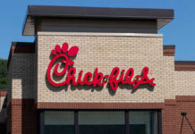 Chick-fil-A restaurant sign on a brick building