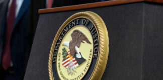 DOJ Pursues DEATH for THIS Killer Department of Justice seal on a podium.