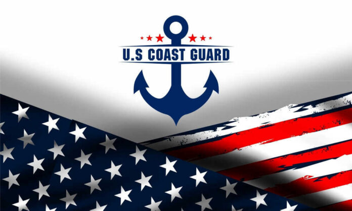 shutterstock_2432114169.jpg US Coast Guard emblem with American flag background