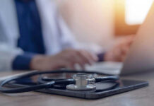Vanessa Trump’s Sudden Health Revelation Stethoscope and tablet on desk, doctor using laptop.