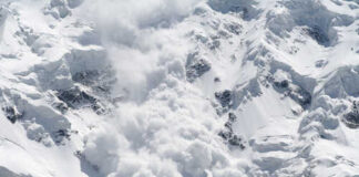 Deadly Avalanche RIPS Climber From Ropes An avalanche cascading down a snowy mountain