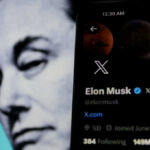 Elon Musks profile on mobile screen, blurred background face.