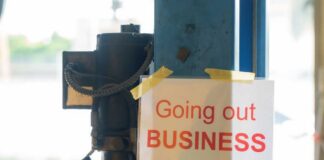 Sign stating 'Going out of Business' attached to a pole