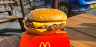 McDonald’s Revives a Delicious Lost Classic A cheeseburger from McDonald's placed on a red box on a wooden table