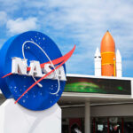 NASA logo with a space shuttle in the background