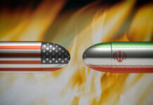 Missile Barrage Foiled — War Map Shifts Bullets painted with U.S. and Iran flags face each other amid flames