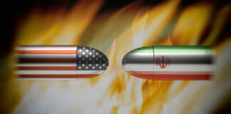 Bullets painted with U.S. and Iran flags face each other amid flames