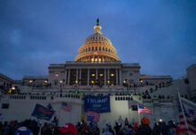 People and Trump supporters outside U.S. Capitol building.