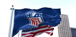 NFL flag waving in front of American flag.