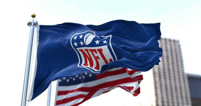NFL flag waving in front of American flag.