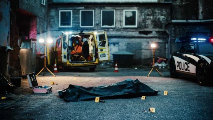 Night,Establishing,Shot:,No,People,Present,In,A,Crime,Scene Police investigation at a crime scene with a covered body and evidence markers