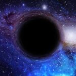 A black hole surrounded by a colorful galaxy filled with stars