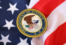 DOJ Walks — Alleged Crypto King Skates Department of Justice seal on American flag.