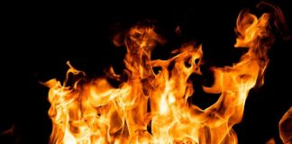 VIDEO: Inferno Masks Chilling Mass Killing Bright orange flames against a black background