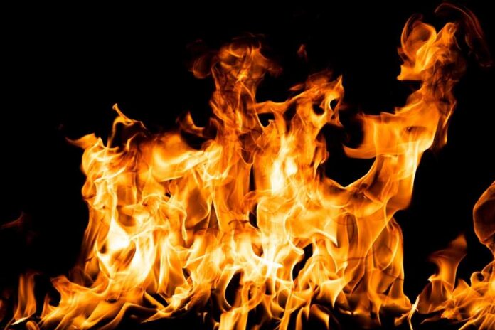 Bright orange flames against a black background