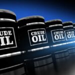 Trump Claims Oil Coup — 65 Billion Barrels Gas storage tanks in an industrial facility during sunrise