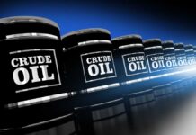 Gas storage tanks in an industrial facility during sunrise