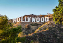 Five-Year Bombshell From Beloved Actor Hollywood Sign on a green hillside, sunny day.