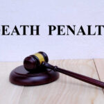 Death Penalty Dropped In THIS Case? A wooden gavel resting on a block with the words 'DEATH PENALTY' in bold above it