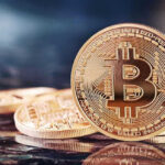 Bitcoin’s $85K Shock: Melt-Up Or Mirage? Bitcoin coins on a reflective surface.