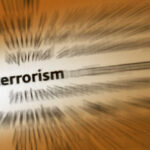 BIG: Crackdown Slams THESE Terror Wallets Blurred text with the word 'terrorism' in focus