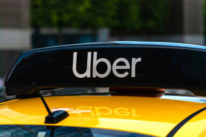Uber,Logo,Icon,On,Top,Of,Yellow,Taxi,Cab,,Close