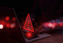 Terror Recruits Age 12 — Online! Warning symbol over laptop with user.