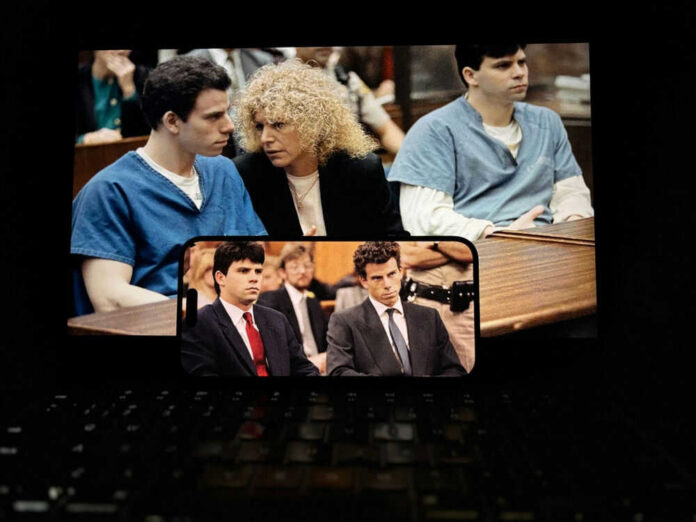 courtroom scenes on a screen with two defendants and a lawyer