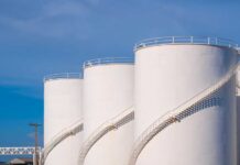 VIDEO: Diesel Shock – Half Refineries Crippled Large white industrial storage tanks with exterior spiral staircases