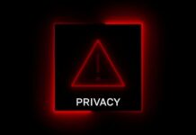 A red neon privacy warning sign with an exclamation mark