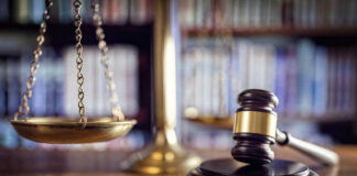 Scales and gavel on a judges desk.