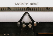 Hollywood Loses Idol – Red State Wins Close-up of a typewriter with a sheet of paper displaying the words 'LATEST NEWS'