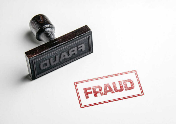 shutterstock_1019053357 Fraud stamp and red stamped imprint on paper