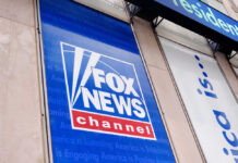 Fox News channel sign on building exterior.