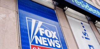 Fox News channel sign on building exterior.