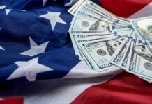 Seven Weeks – $2M Revenue Stack of hundred dollar bills on an American flag