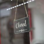 Cookie Darling SHUTS A closed sign hanging on a shop window